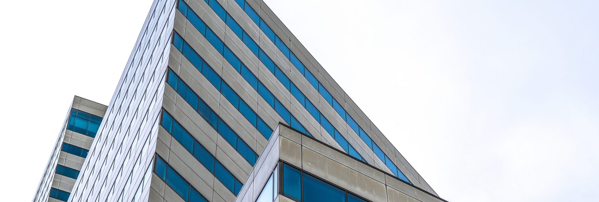 A modern skyscraper with many windows during daytime